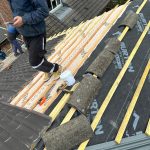 Roofer working on roof